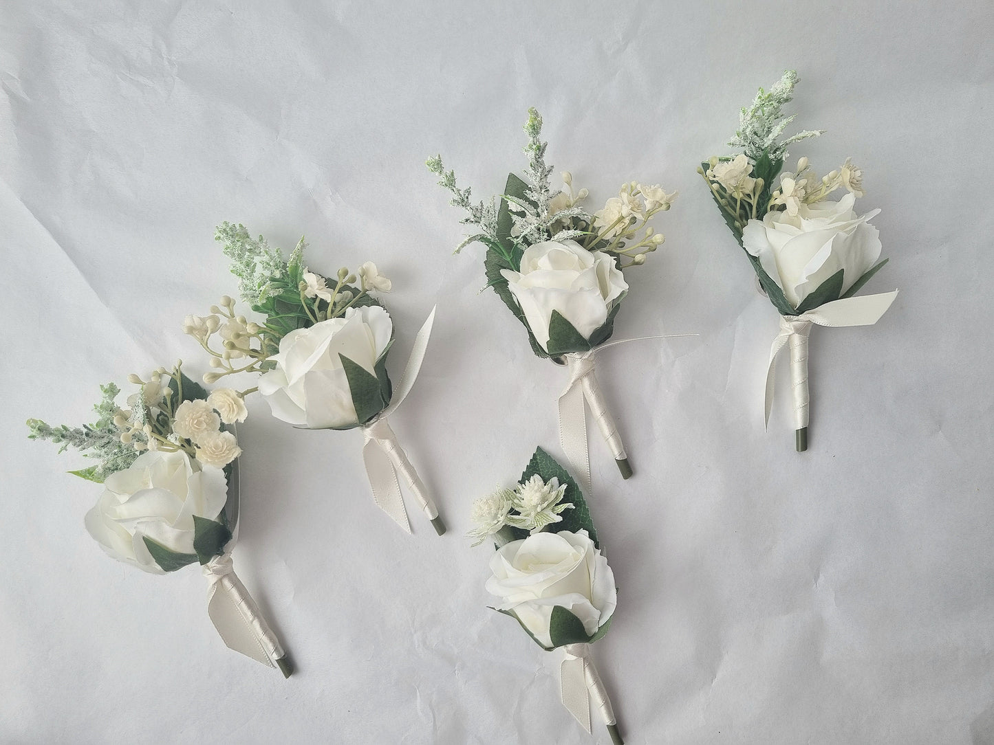 Dusty blue & ivory buttonholes & dress corsage