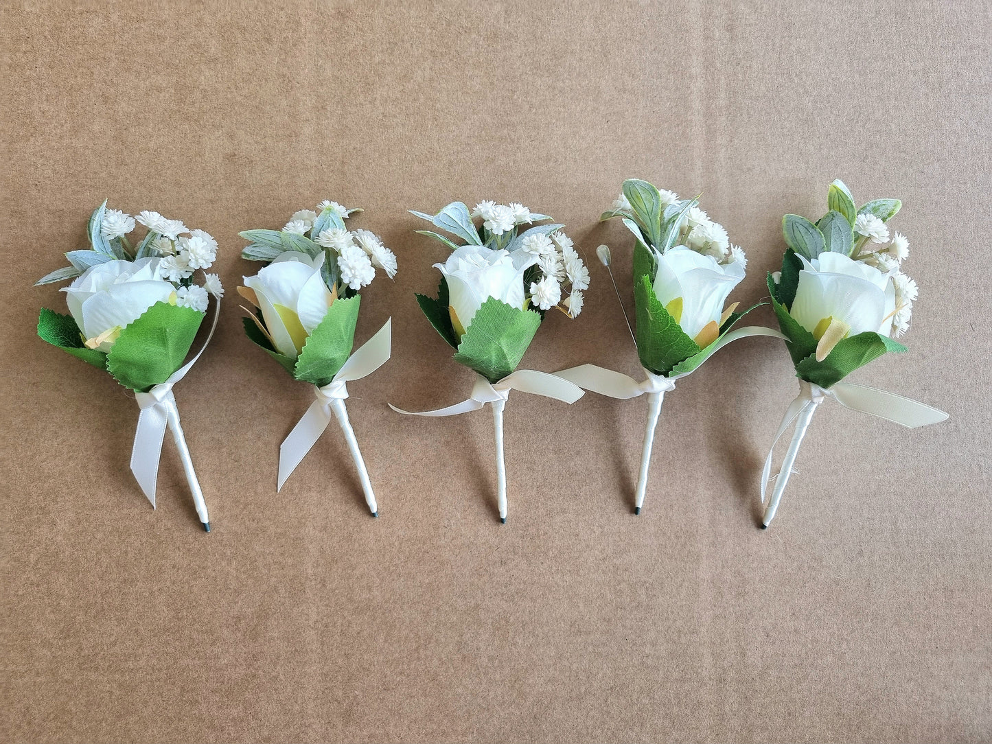 Dusty blue & ivory buttonholes & dress corsage