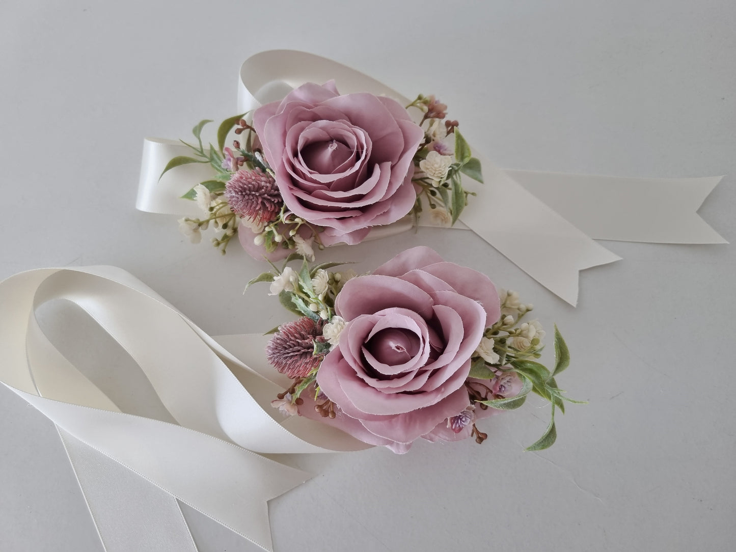 Mauve buttonholes & wrist corsage