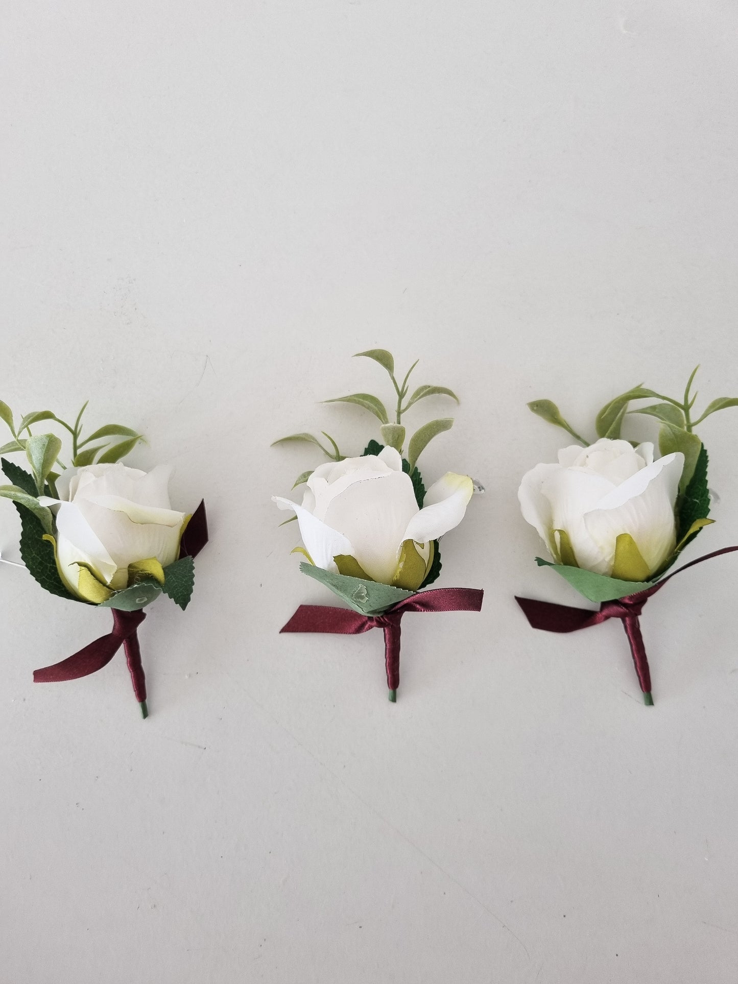 Burgundy, blush & ivory buttonholes